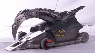 Razer from Robot Wars, a low metal robot with a large curved crushing claw.